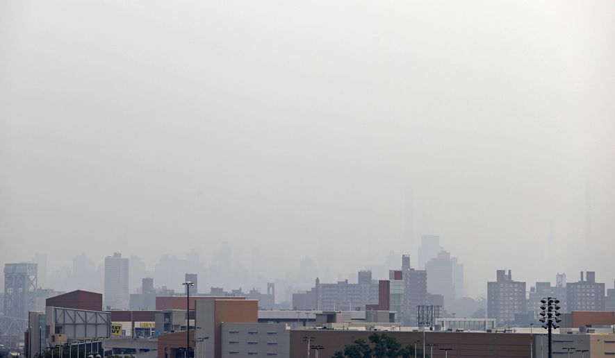Smoke blocks the view looking toward Manhattan from Yankee Stadium before the Philadelphia Phillies played the New York Yankees in a baseball game Tuesday, July 20, 2021, in New York. (AP Photo/Adam Hunger)