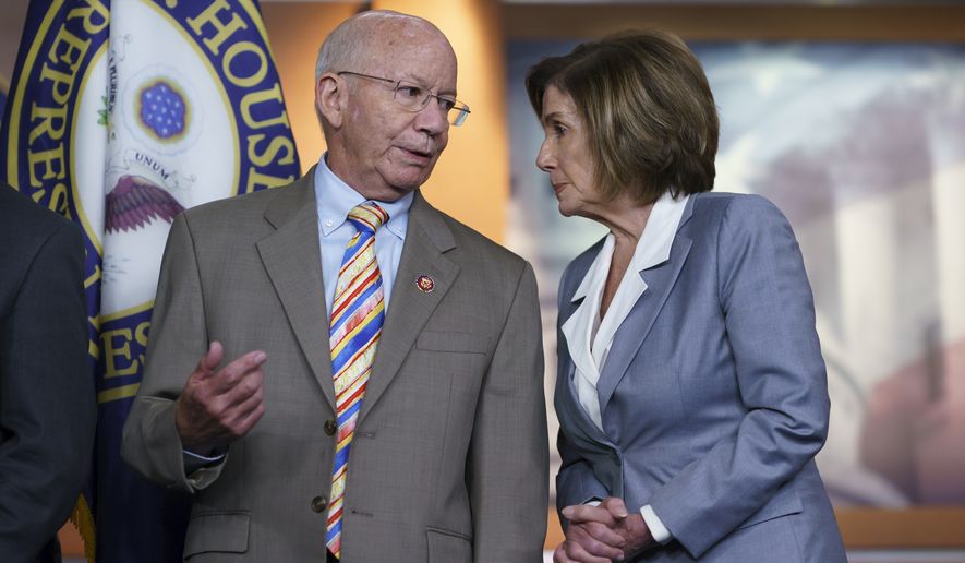 House Transportation and Infrastructure Committee Chair Peter DeFazio, D-Ore., left, talks to Speaker of the House Nancy Pelosi, D-Calif., during a news conference. (AP Photo/J. Scott Applewhite)