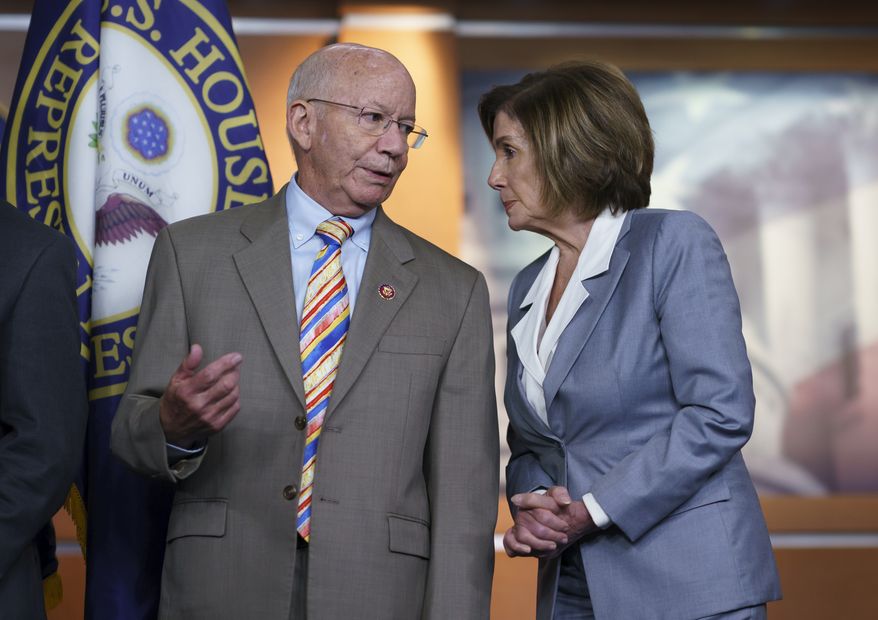 House Transportation and Infrastructure Committee Chair Peter DeFazio, D-Ore., left, talks to Speaker of the House Nancy Pelosi, D-Calif., during a news conference. (AP Photo/J. Scott Applewhite)