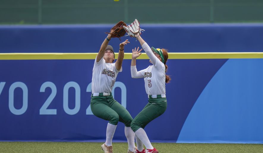 Mexico&#39;s Nicole Rangel, left, and Suzannah Brookshire collide as they attempt to take a catch during the softball game between the Mexico and Japan at the 2020 Summer Olympics, Thursday, July 22, 2021, in Fukushima , Japan. (AP Photo/Jae C. Hong)