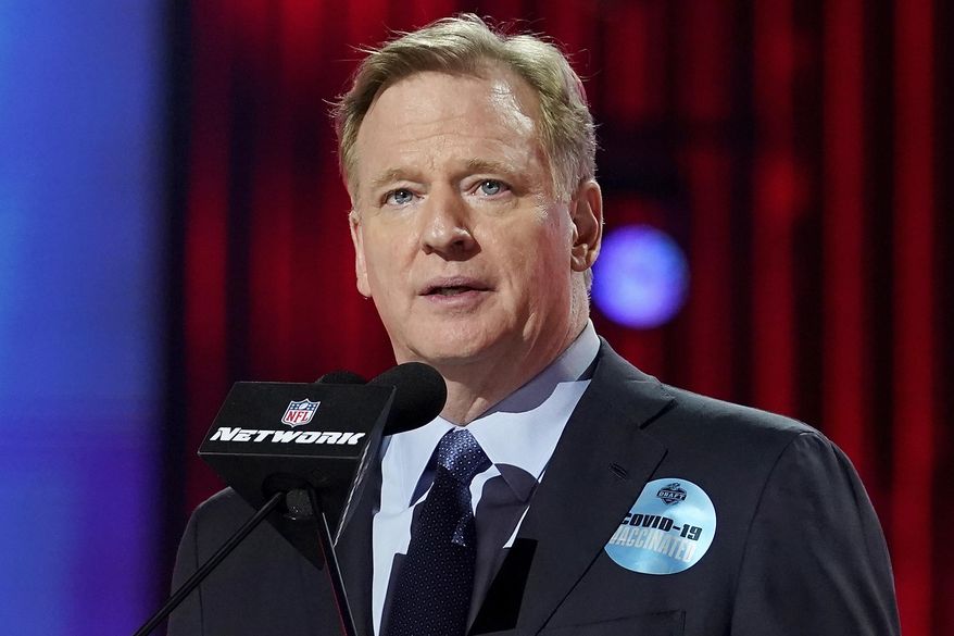 In this April 29, 2021, file photo, NFL commissioner Roger Goodell, wearing a COVID-19 vaccinated sticker, speaks during the first round of the NFL football draft in Cleveland. (AP Photo/Steve Luciano) **FILE**