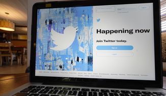 The login/sign-up screen for a Twitter account is seen on a laptop computer in Orlando, Fla., on Tuesday, April 27, 2021. (AP Photo/John Raoux) **FILE**