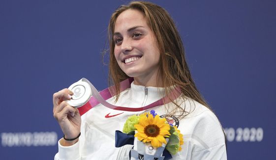 Emma Weyant, of United States, poses with her silver medal on the podium for the women&#39;s 400-meter Individual medley at the 2020 Summer Olympics, Sunday, July 25, 2021, in Tokyo, Japan. (AP Photo/Matthias Schrader) ** FILE **