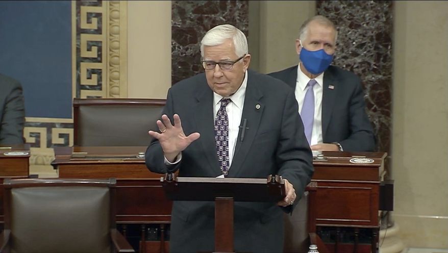 In this Dec. 2, 2020, file photo taken from U.S. Senate video, Wyoming&#x27;s low-key senior U.S. Sen. Mike Enzi says goodbye to colleagues, in Washington. Enzi, who was hospitalized Monday, July 26, 2021, with a broken neck and ribs three days after a bicycle accident outside his hometown, has died at age 77. (U.S. Senate via AP, file)