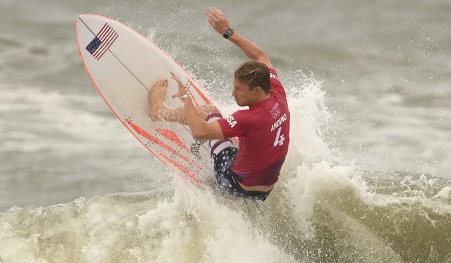 Kolohe Andino, of the United States, maneuvers on a wave during third round of the men&#x27;s surfing competition at the 2020 Summer Olympics, Monday, July 26, 2021, at Tsurigasaki beach in Ichinomiya, Japan. (AP Photo/Francisco Seco)