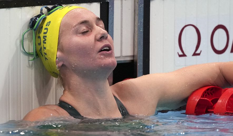 Ariarne Titmus of Australia rests after winning the final of the women&#x27;s 400-meters freestyle at the 2020 Summer Olympics, Monday, July 26, 2021, in Tokyo, Japan. (AP Photo/Matthias Schrader)