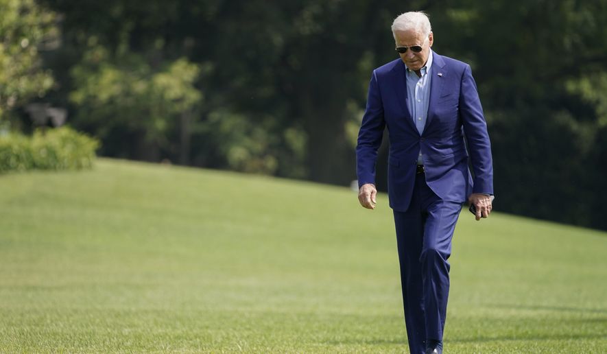 President Joe Biden walks on the South Lawn of the White House after stepping off Marine One, Sunday, July 25, 2021, in Washington. Biden is returning to Washington after spending the weekend in Delaware. (AP Photo/Pablo Martinez Monsivais)