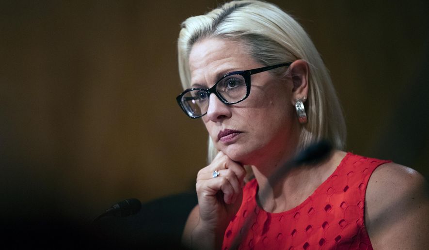 In this July 16, 2019, file photo, Sen. Kyrsten Sinema, D-Ariz., listens to witnesses during a hearing on 2020 census on Capitol Hill in Washington. (AP Photo/Manuel Balce Ceneta) ** FILE **