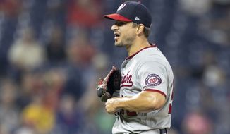 Washington Nationals closing pitcher Brad Hand reacts to the team&#39;s 6-4 win over the Philadelphia Phillies in a baseball game, Tuesday, July 27, 2021, in Philadelphia. (AP Photo/Laurence Kesterson)