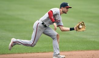 Washington Nationals shortstop Trea Turner fields a grounder by Baltimore Orioles&#39; Trey Mancini during the sixth inning of a baseball game, Sunday, July 25, 2021, in Baltimore. Mancini was out at first on the play. (AP Photo/Nick Wass)