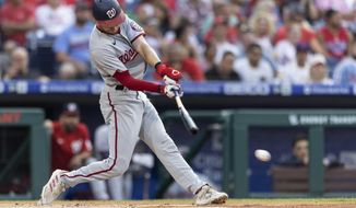 Washington Nationals&#39; Trea Turner hits a single during the first inning of the team&#39;s baseball game against the Philadelphia Phillies, Tuesday, July 27, 2021, in Philadelphia. (AP Photo/Laurence Kesterson)