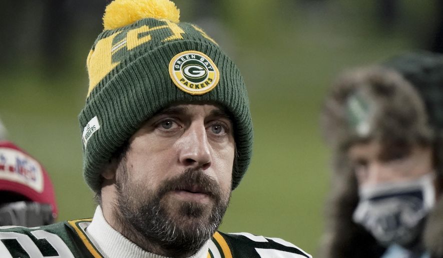 FILE - In this Sunday, Jan. 24, 2021, file photo, Green Bay Packers quarterback Aaron Rodgers (12) walks off the field after the NFC championship NFL football game against the Tampa Bay Buccaneers in Green Bay, Wis.  In a news conference, Monday, July 5, 2021, reigning NFL MVP Rodgers said he has spent this offseason focusing on improving himself in every respect, and that goes beyond making sure he’s in top physical shape. (AP Photo/Morry Gash, File)