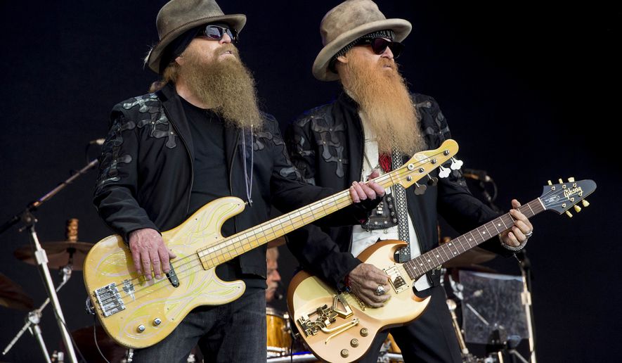 Dusty Hill, left, and Billy Gibbons from U.S rock band ZZ Top perform at the Glastonbury music festival in Somerset, England, June 24, 2016. (Photo by Jonathan Short/Invision/AP, File)