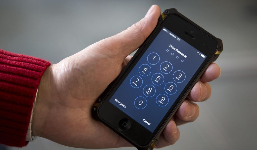 In this Feb. 17, 2016, file photo, an iPhone is seen in Washington. At a time of widespread digital insecurity, it turns out that the oldest and simplest computer fix there is — turning a device off and then back on again — can thwart hackers from stealing information from smartphones. (AP Photo/Carolyn Kaster, File)