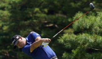 Korea&#39;s Si Woo Kim plays a tee shot from the 12th hole during a practice round of the men&#39;s golf event at the 2020 Summer Olympics, Tuesday, July 27, 2021, at the Kasumigaseki Country Club in Kawagoe, Japan, (AP Photo/Matt York)