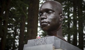 In this Sunday Feb. 21, 2021, file photo, the bust of York is seen on Mount Tabor in southeast Portland, Ore. Officials say the bust of York, commemorating an enslaved Black member of the Lewis and Clark Expedition was toppled and damaged. A Portland Parks and Recreation spokesperson told KOIN 6 News that the bust of York was torn from its pedestal and significantly damaged Tuesday night, July 27, or early Wednesday. (Mark Graves/The Oregonian via AP, File)