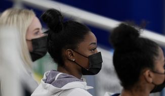 United States gymnast Simone Biles sits on the stands during the artistic gymnastics women&#39;s all-around final at the 2020 Summer Olympics, Thursday, July 29, 2021, in Tokyo, Japan. (AP Photo/Natacha Pisarenko)
