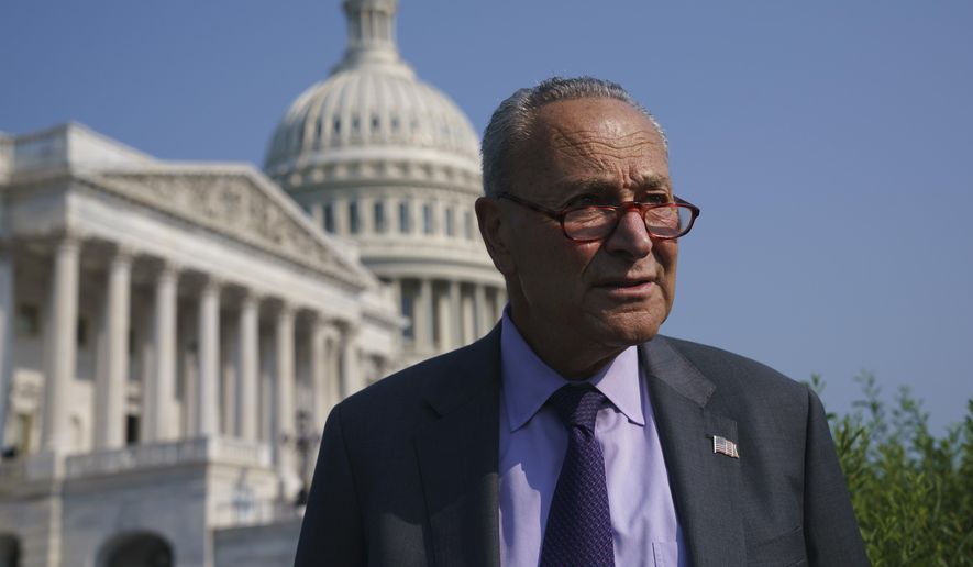 Senate Majority Leader Chuck Schumer, D-N.Y., arrives to meet with Speaker of the House Nancy Pelosi, D-Calif., before an event to promote investments in clean jobs, at the Capitol in Washington, Wednesday, July 28, 2021. (AP Photo/J. Scott Applewhite)