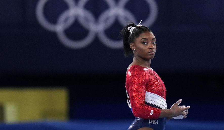 This July 27, 2021, file photo shows Simone Biles, of the United States, waiting to perform on the vault during the artistic gymnastics women&#x27;s final at the 2020 Summer Olympics, Tuesday, July 27, 2021, in Tokyo. Biles’ sponsors including Athleta and Visa are lauding her decision to put her mental health first and withdraw from the gymnastics team competition during the Olympics. It’s the latest example of sponsors praising athletes who are increasingly open about mental health issues. (AP Photo/Gregory Bull, File)