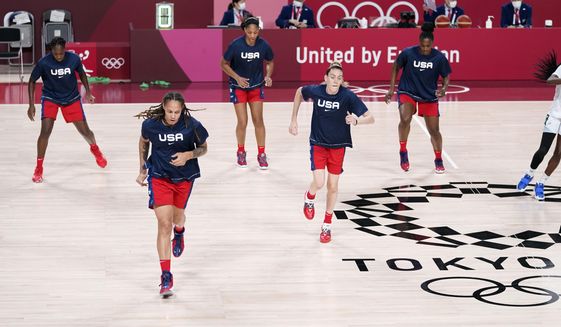 United State&#39;s Brittney Griner and Breanna Stewart warm up with teammates Tina Charles, rear left, A&#39;ja Wilson and Sylvia Fowles, rear right, before a women&#39;s basketball preliminary round game against Nigeria at the 2020 Summer Olympics, Tuesday, July 27, 2021, in Saitama, Japan. The U.S. has an embarrassment of riches when it comes to talented post players, possibly the best ever assembled. (AP Photo/Charlie Neibergall)