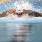 Caeleb Dressel of the United States swims in a heat of the men&#39;s 100-meter butterfly at the 2020 Summer Olympics, Thursday, July 29, 2021, in Tokyo, Japan. (AP Photo/Matthias Schrader)