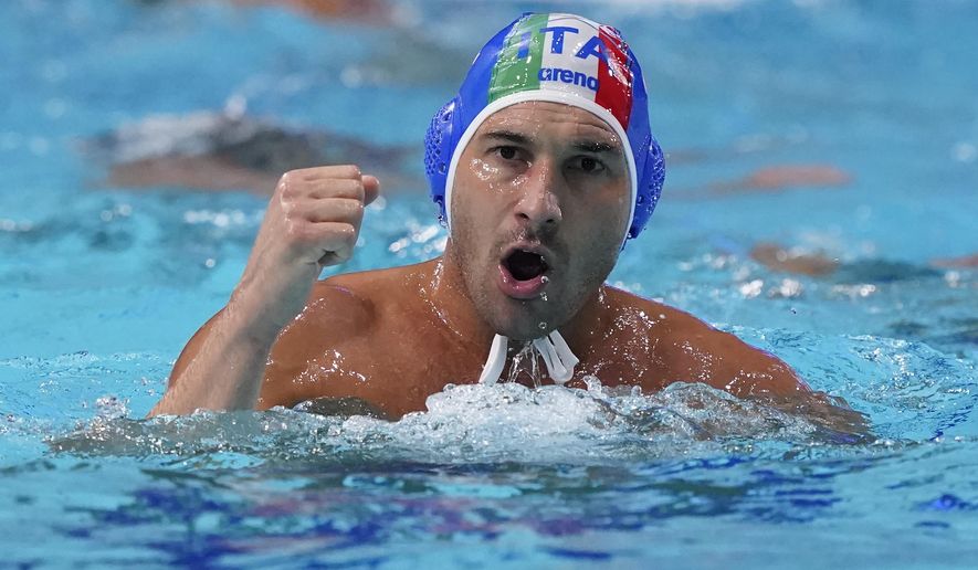 Italy&#x27;s Pietro Figlioli celebrates after a score against the United States during a preliminary round men&#x27;s water polo match at the 2020 Summer Olympics, Thursday, July 29, 2021, in Tokyo, Japan. (AP Photo/Mark Humphrey)