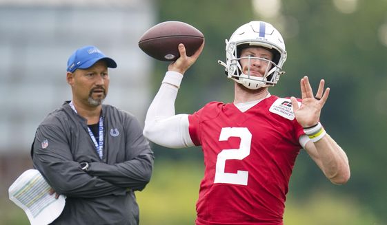 Indianapolis Colts quarterback Carson Wentz throws during practice at the NFL team&#39;s football training camp in Westfield, Ind., Thursday, July 29, 2021. (AP Photo/Michael Conroy) **FILE**