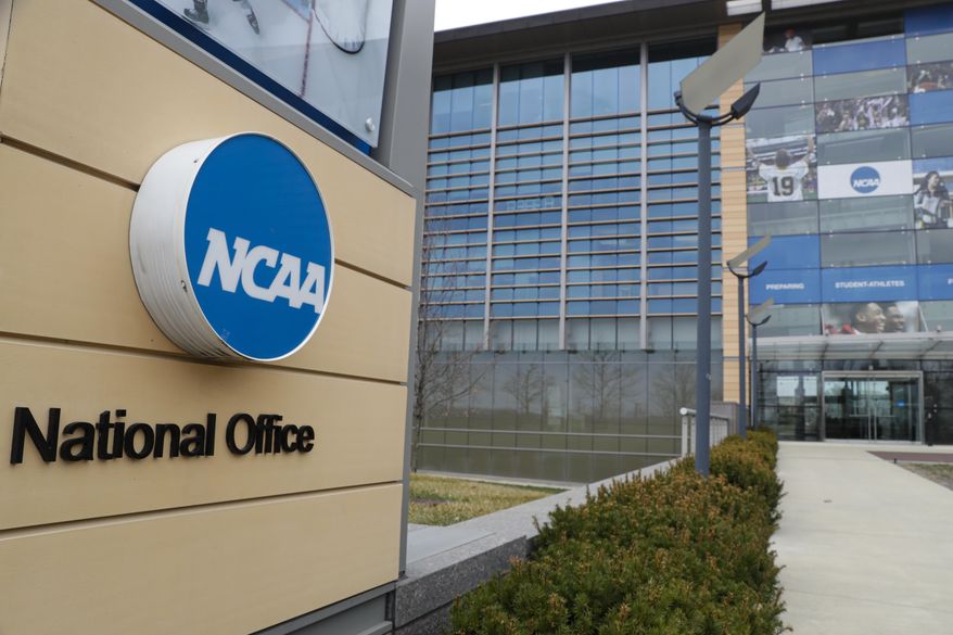 This is a March 12, 2020, file photo showing NCAA headquarters in Indianapolis. (AP Photo/Michael Conroy, File)