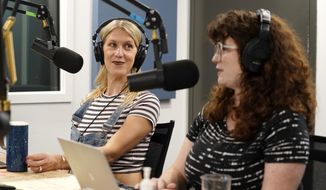 Tess Barker, left, and Barbara Gray, co-hosts of the &amp;quot;Britney&#39;s Gram&amp;quot; podcast, talk in the studio at Earwolf podcast studio, Thursday, July 15, 2021, in Los Angeles. (AP Photo/Chris Pizzello)