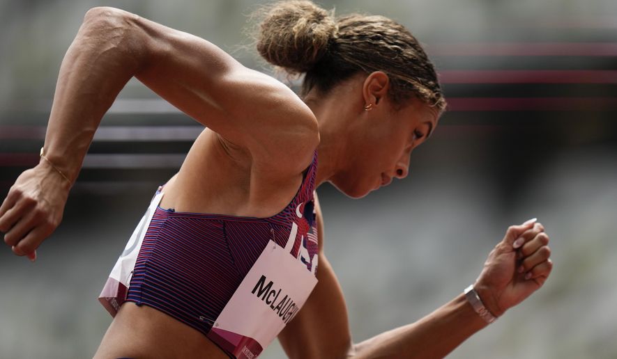Sydney Mclaughlin, of United States, wins a heat in the women&#x27;s 400-meter hurdles at the 2020 Summer Olympics, Saturday, July 31, 2021, in Tokyo. (AP Photo/Petr David Josek)