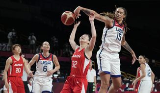Japan&#39;s Saori Miyazaki (32), center, is blocked by United States&#39; Brittney Griner (15), second right, during women&#39;s basketball preliminary round game at the 2020 Summer Olympics, Friday, July 30, 2021, in Saitama, Japan. (AP Photo/Eric Gay)