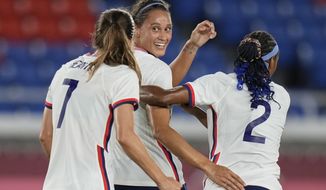 United States&#39; Lynn Williams, center, celebrates with teammates after scoring a goal against Netherlands during a women&#39;s quarterfinal soccer match at the 2020 Summer Olympics, Friday, July 30, 2021, in Yokohama, Japan. (AP Photo/Silvia Izquierdo)