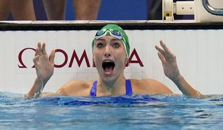 Tatjana Schoenmaker, of South Africa, celebrates after winning the gold medal in the women&#39;s 200-meter breaststroke final at the 2020 Summer Olympics, Friday, July 30, 2021, in Tokyo, Japan. (AP Photo/Gregory Bull)
