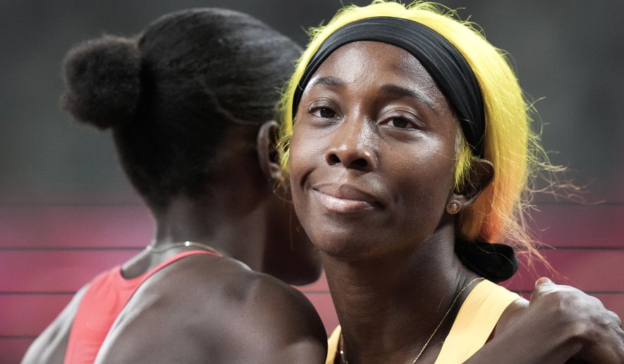 Shelly-Ann Fraser-Pryce, of Jamaica, wins a women&#x27;s 100-meter semifinal at the 2020 Summer Olympics, Saturday, July 31, 2021, in Tokyo. (AP Photo/Petr David Josek)