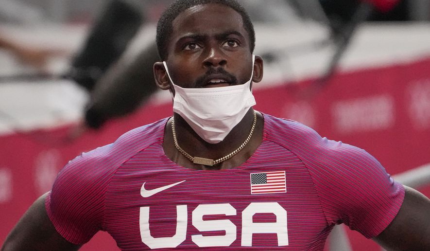Trayvon Bromell, of United States, finishes a heat in the men&#x27;s 100-meter run at the 2020 Summer Olympics, Saturday, July 31, 2021, in Tokyo. (AP Photo/Charlie Riedel)
