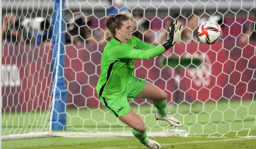 United States&#39; goalkeeper Alyssa Naeher stops a ball in a the penalty shootout against Netherlands during a women&#39;s quarterfinal soccer match at the 2020 Summer Olympics, Friday, July 30, 2021, in Yokohama, Japan. (AP Photo/Silvia Izquierdo)