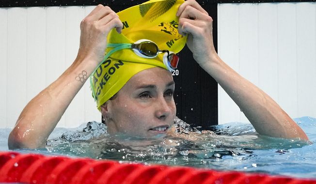 Emma Mckeon, of Australia, finishes a women&#x27;s 50-meter freestyle heat at the 2020 Summer Olympics, Friday, July 30, 2021, in Tokyo, Japan. (AP Photo/Jae C. Hong)