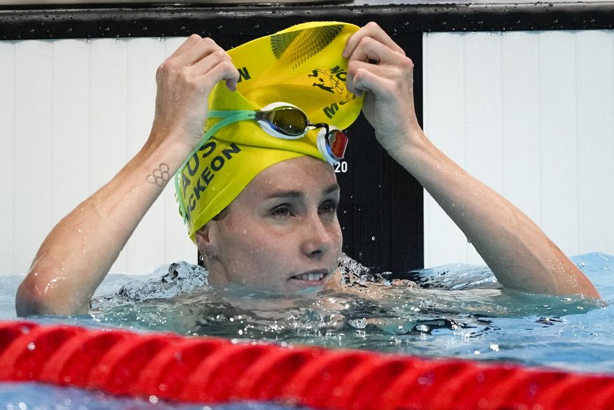 Emma Mckeon, of Australia, finishes a women&#x27;s 50-meter freestyle heat at the 2020 Summer Olympics, Friday, July 30, 2021, in Tokyo, Japan. (AP Photo/Jae C. Hong)