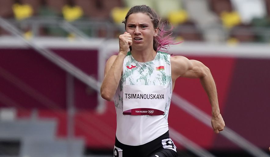 Krystsina Tsimanouskaya, of Belarus, runs in the women&#39;s 100-meter run at the 2020 Summer Olympics, Friday, July 30, 2021. Tsimanouskaya alleged her Olympic team tried to remove her from Japan in a dispute that led to a standoff Sunday, Aug. 1, at Tokyo’s main airport. An activist group supporting Tsimanouskaya said she believed her life was in danger in Belarus and would seek asylum with the Austrian embassy in Tokyo. (AP Photo/Martin Meissner) **FILE**