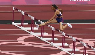 Sydney Mclaughlin, of United States, wins a heat in the women&#39;s 400-meter hurdles at the 2020 Summer Olympics, Saturday, July 31, 2021, in Tokyo. (AP Photo/Martin Meissner)