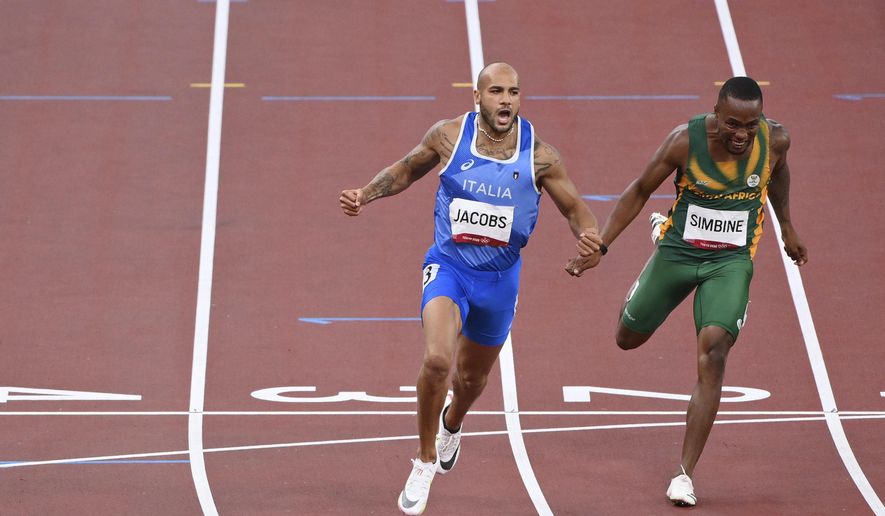 Lamont Marcell Jacobs, of Italy, celebrates after winning the final of the men&#x27;s 100-meters at the 2020 Summer Olympics, Sunday, Aug. 1, 2021, in Tokyo. (Alfredo Falcone/LaPresse via AP)