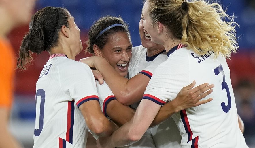 United States&#x27; Lynn Williams, center, celebrates with teammates after scoring a goal against Netherlands during a women&#x27;s quarterfinal soccer match at the 2020 Summer Olympics, Friday, July 30, 2021, in Yokohama, Japan. (AP Photo/Silvia Izquierdo)