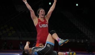 United States&#39; Adeline Maria Gray, top, celebrates after winning against Kyrgyzstan&#39;s Aiperi Medet Kyzy during the semi-final round of the women&#39;s 76kg freestyle wrestling match at the 2020 Summer Olympics, Sunday, Aug. 1, 2021 in Chiba, Japan. (AP Photo/Aaron Favila)