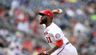 Washington Nationals relief pitcher Wander Suero (51) delivers a pitch during a baseball game against the Chicago Cubs, Sunday, Aug. 1, 2021, in Washington. (AP Photo/Nick Wass) **FILE**