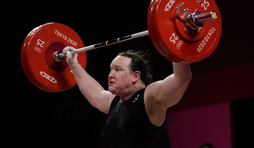 In this file photo, Laurel Hubbard of New Zealand competes in the women&#39;s +87kg weightlifting event at the 2020 Summer Olympics, Monday, Aug. 2, 2021, in Tokyo, Japan. (AP Photo/Seth Wenig)