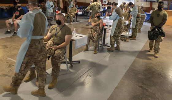 Troops get the second dose of Moderna COVID-19 vaccine during a vaccination event. (U.S. Navy photo by Mass Communication Specialist 1st Class Natalia Murillo)