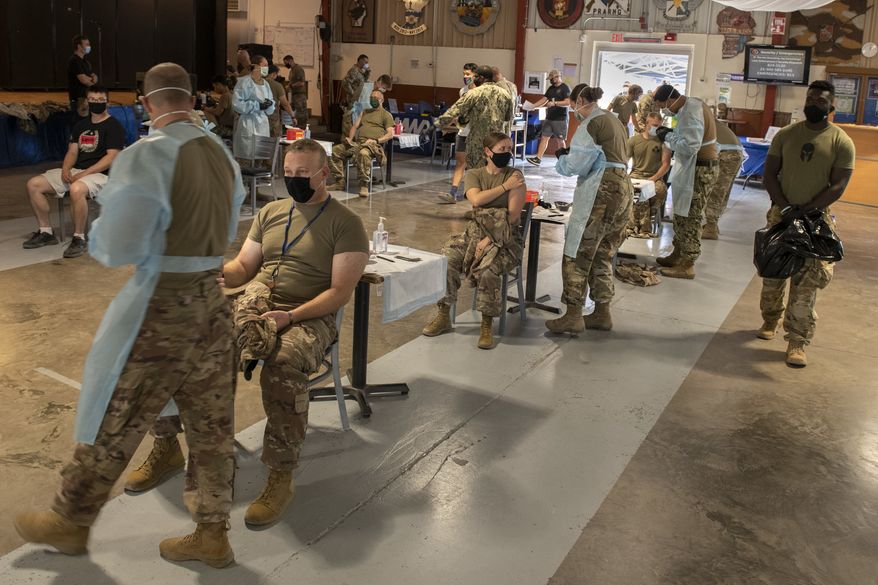 Troops get the second dose of Moderna COVID-19 vaccine during a vaccination event. (U.S. Navy photo by Mass Communication Specialist 1st Class Natalia Murillo)