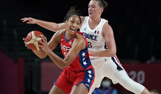 United States&#x27; A&#x27;Ja Wilson (9), left, passes ahead of France&#x27;s Alexia Chartereau (6) during women&#x27;s basketball preliminary round game at the 2020 Summer Olympics, Monday, Aug. 2, 2021, in Saitama, Japan. (AP Photo/Charlie Neibergall)
