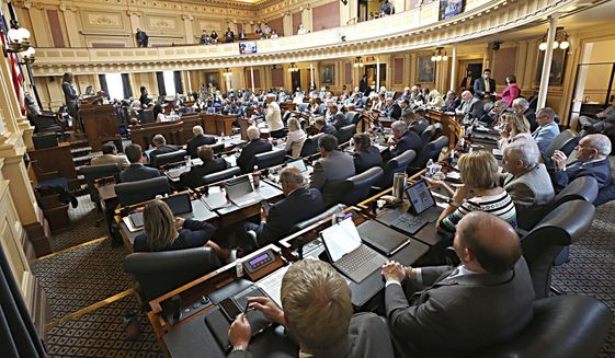 Members fill the chamber as the House of Delegates began the session inside the Virginia State Capitol in Richmond, VA Monday, Aug. 2, 2021, the first day of the General Assembly Special Session. (Bob Brown/Richmond Times-Dispatch via AP)