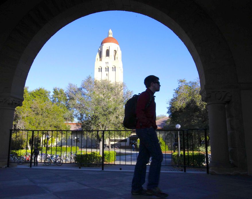 In this Wednesday, Feb. 15, 2012, photo, a student walks in front of Hoover Tower on the Stanford University campus in Palo Alto, Calif. (AP Photo/Paul Sakuma) **FILE**
